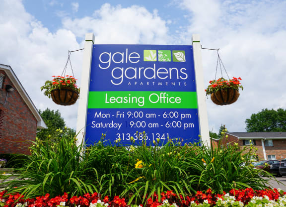 Gale Gardens Leasing Office sign with flower landscaping
