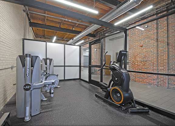 Apartments with a gym in Grand Rapids. Weight machines, free weights, punching bag.