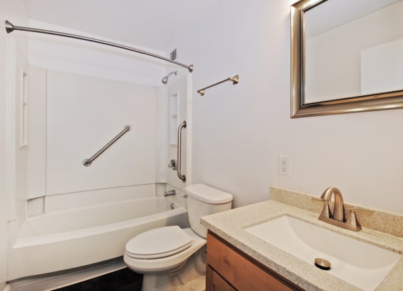 a bathroom with a sink toilet and a shower