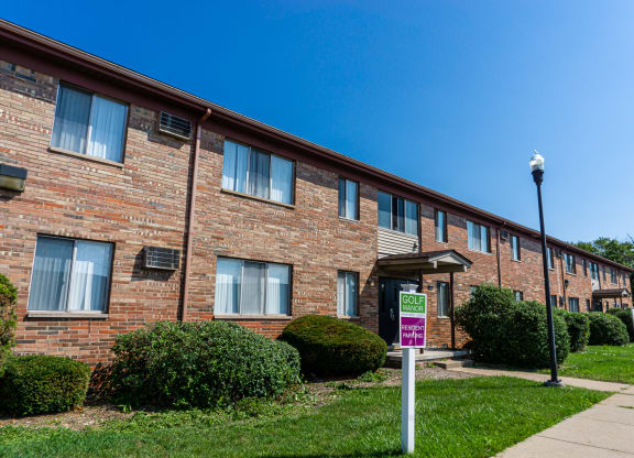 Exterior of apartment entrance at resident only parking at Golf Manor Apartments in Roseville, Michigan