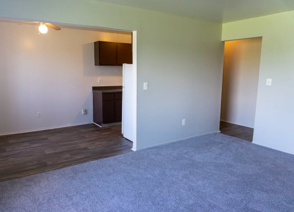 Spacious living room and dining room at Golf Manor Apartments in Roseville, Michigan