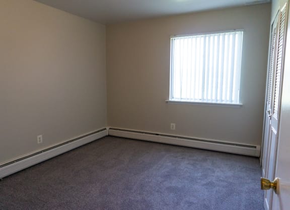Spacious bedroom at Golf Manor Apartments in Roseville, Michigan