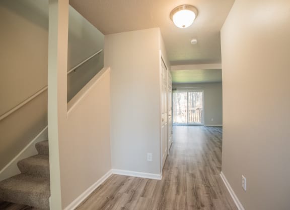 Spacious layout, stairs, and newly renovated wood floors at Westwind Townhomes in Lansing, Michigan