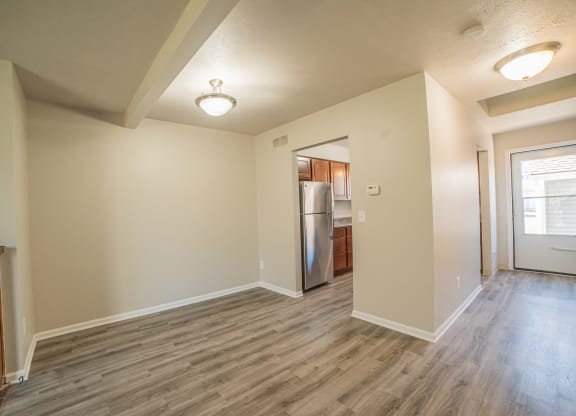 Spacious layout, dining room, kitchenand newly renovated wood floors at Westwind Townhomes in Lansing, Michigan