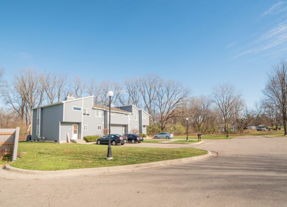 Building Exteriors and parking spaces at Westwind Townhomes in Lansing. Michigan