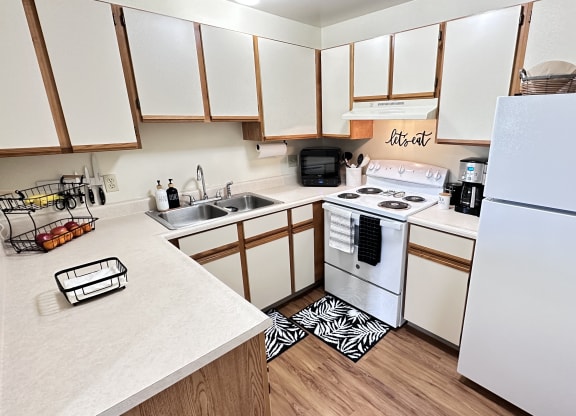 the preserve at ballantyne commons apartment kitchen with white appliances