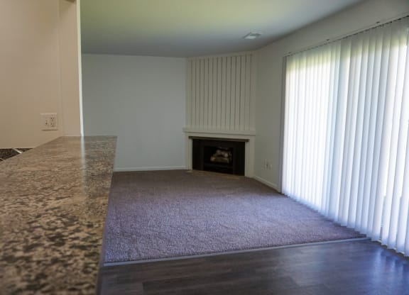 Granite bar top and fire place in the background at Woodcrest Apartments in Westland, Michigan