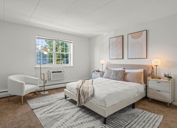 a bedroom with a bed and a chair  at Chestnut Hill Village, Pennsylvania