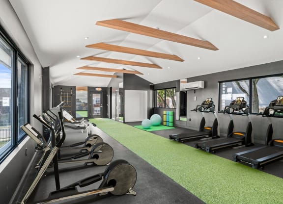 a gym with treadmills and other exercise equipment  at Chestnut Hill Village, Philadelphia, PA