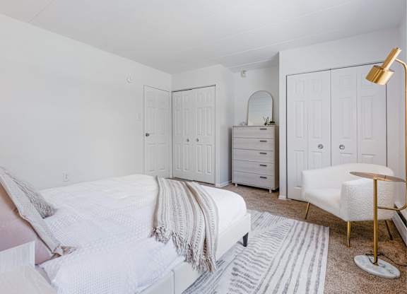 Bedroom with double closets and dresser at Chestnut Hill Village Apartments, Philadelphia, PA
