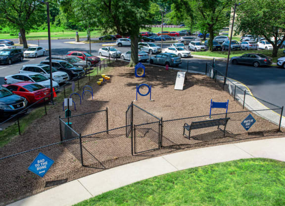 a playground in a park with cars parked in a parking lot at Parkview Towers, Collingswood, NJ