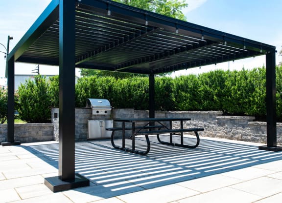 a picnic table under awning on a patio at Chestnut Hill Village, Pennsylvania