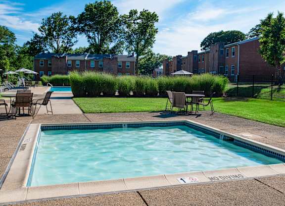 our apartments have a resort style pool and lounge chairs