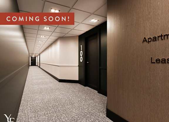 A hallway with a sign that says "Apartment Lease" on the wall.