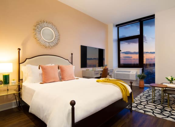 a bedroom with a bed and a large window at The Irvine, Pennsylvania