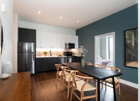 a kitchen and dining room with a table and chairs at The Irvine, Philadelphia, PA