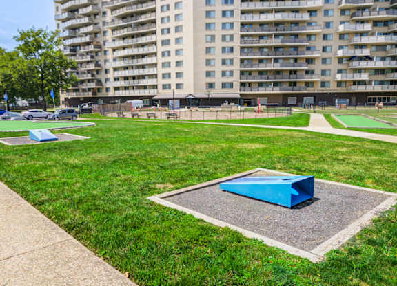 A park with a blue object in the middle of a concrete square at Premier at Cherry Hill, New Jersey