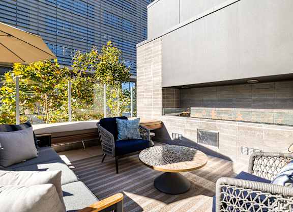 Patio with a couch at K1 Apartments, San Diego
