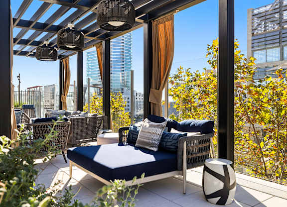 Patio with a couch and a table at K1 Apartments, California