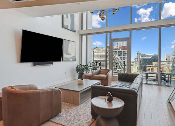 Living room with leather furniture at K1 Apartments, San Diego, 92101