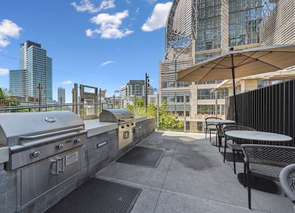 Outdoor patio with a grill at K1 Apartments, San Diego, CA, 92101