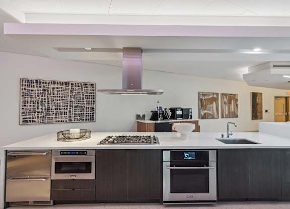 Kitchen with a white counter top at K1 Apartments, San Diego, CA, 92101