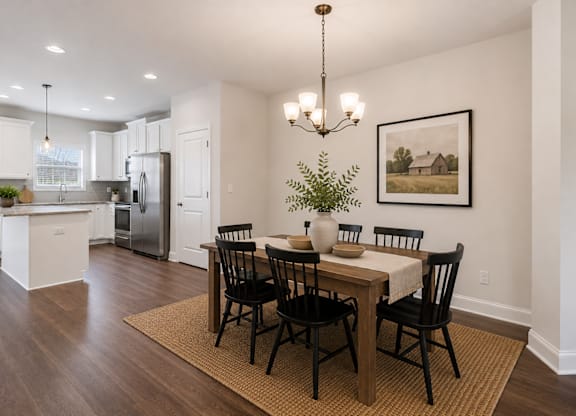 Elegant dining room featuring a rich wooden table and timeless seating—designed for unforgettable family gatherings.