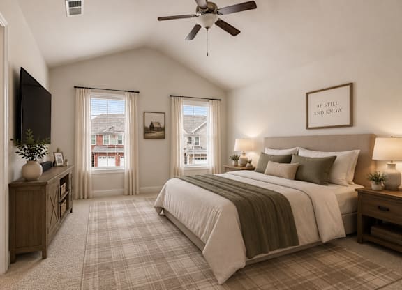 Spacious primary suite featuring a luxurious king bed, elegant finishes, and tranquil accents—designed for comfort, relaxation, and everyday retreat.