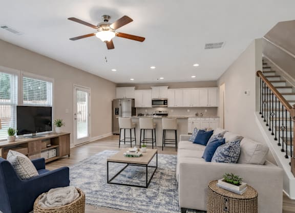 Living room with large window letting in a ton of natural light.