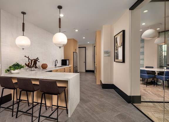 Kitchen with a bar area at Accent Apartments, Los Angeles, California
