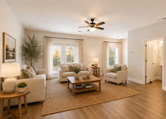Spacious living room filled with abundant natural light.