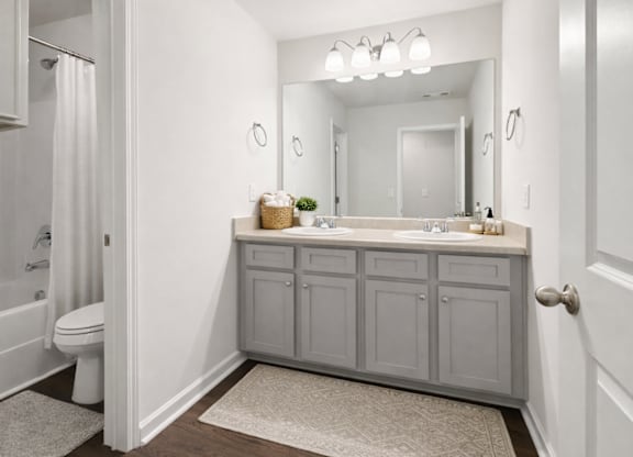 Secondary suite bathroom with a tub and shower combination