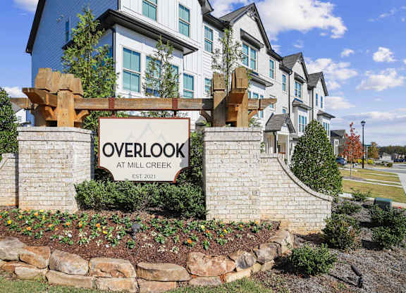 A sign that says Overlook at Mill Creek Established 2021.