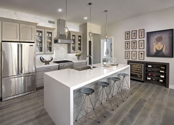 a kitchen with a large island and stainless steel appliances at Novella Arcadia, Phoenix Arizona