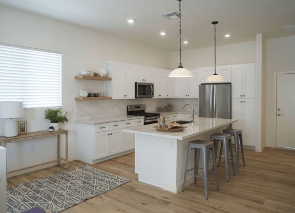 a kitchen with a center island and a counter top at Novella Biltmore, Phoenix, AZ 85016