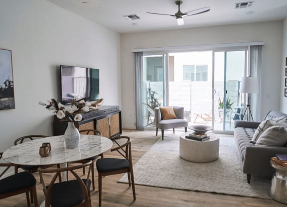 a living room with a couch and a table at Novella Biltmore, Phoenix, 85016
