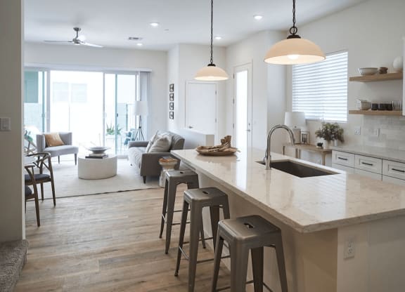 a large kitchen with a center island and bar stools at Novella Biltmore, Phoenix Arizona