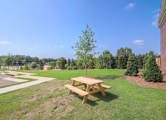 Enjoy the outdoors with charming community spaces featuring picnic seating.