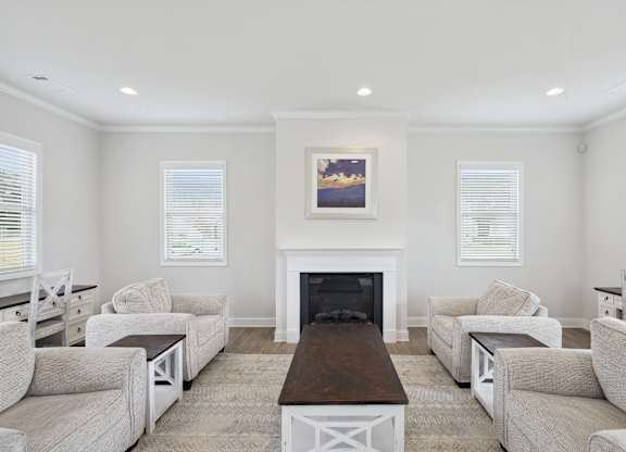Elegant clubhouse lounge featuring a fireplace.