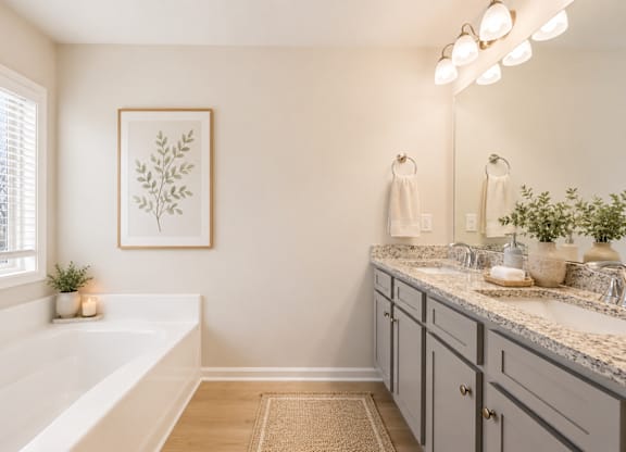 Elegant en suite with a double vanity off the primary bedroom.