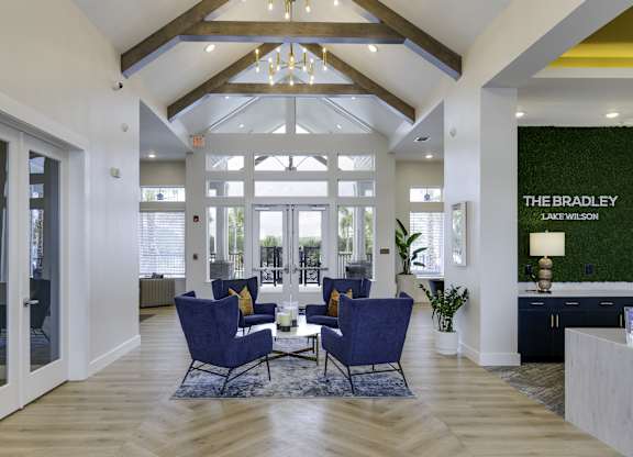 the bradley living room with blue chairs and a table