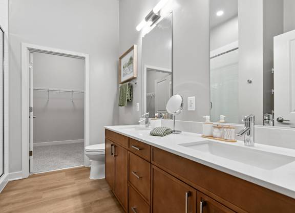 A bathroom with a white toilet and a white sink.