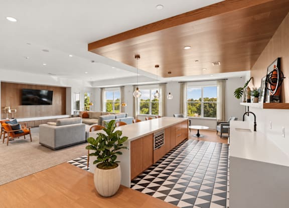 A modern kitchen with a black and white checkered floor.