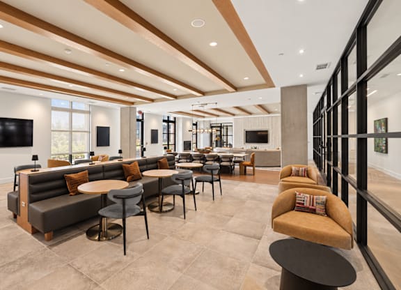 A modern living room with a brown and beige color scheme.