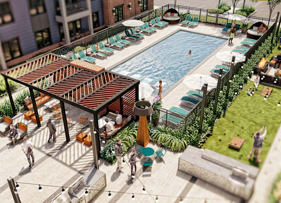 A pool area with people relaxing and a bar area.