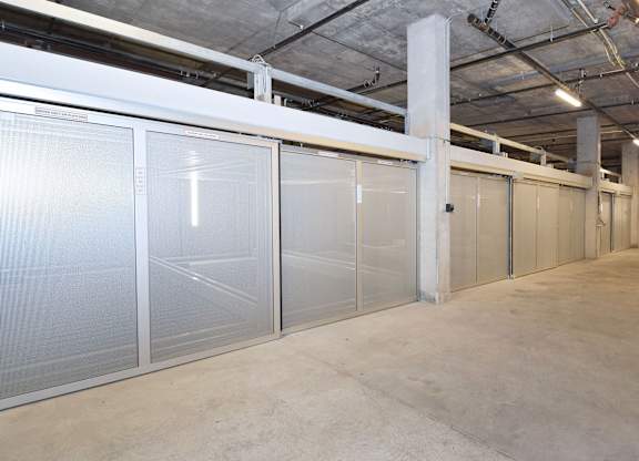 a row of stainless steel doors in a warehouse