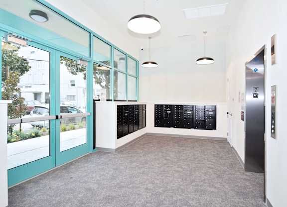 a hallway with blue doors and a door to a filing cabinet