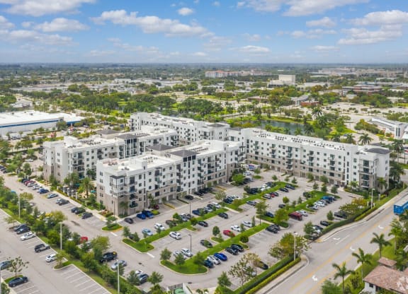 an aerial view of an urban area with many apartment buildings and cars