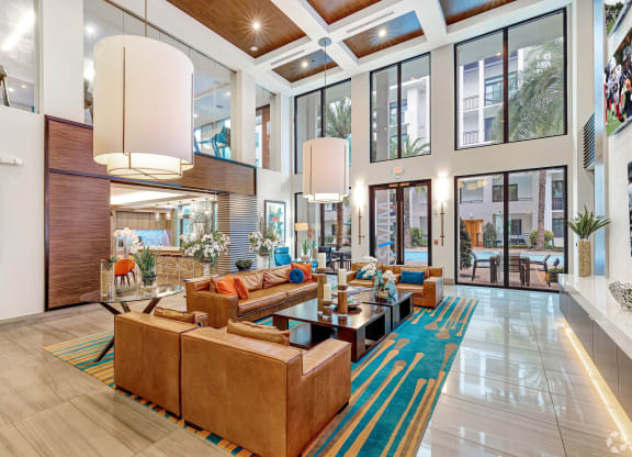 a large lobby with couches and a coffee table