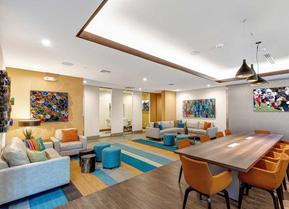a living room with couches and chairs and a table